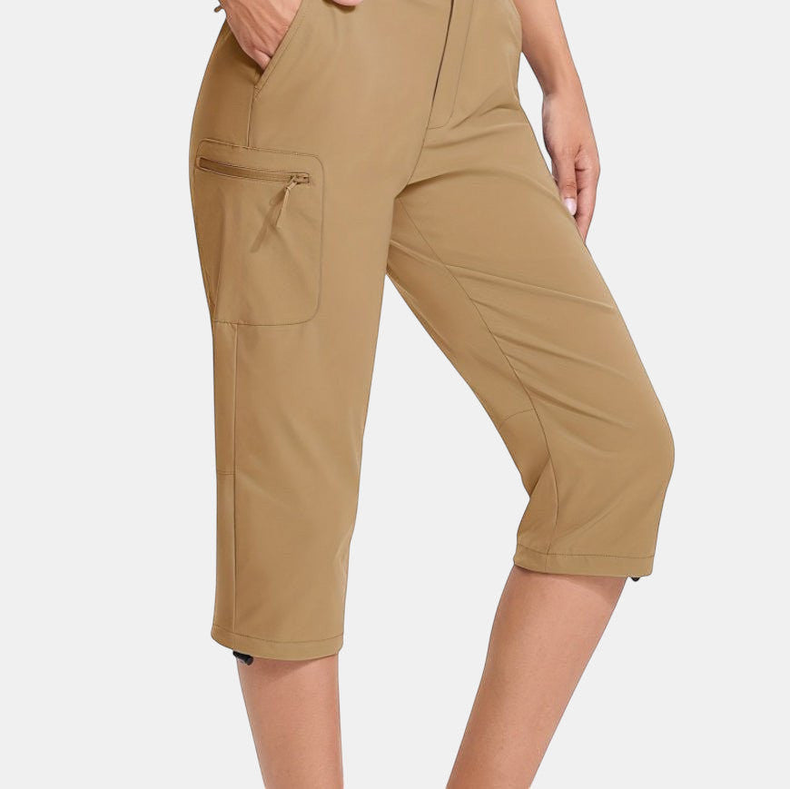 ZOFIA ATELIER Khaki PVC capri pants with asymmetric patchwork design and zippered cargo pocket.
