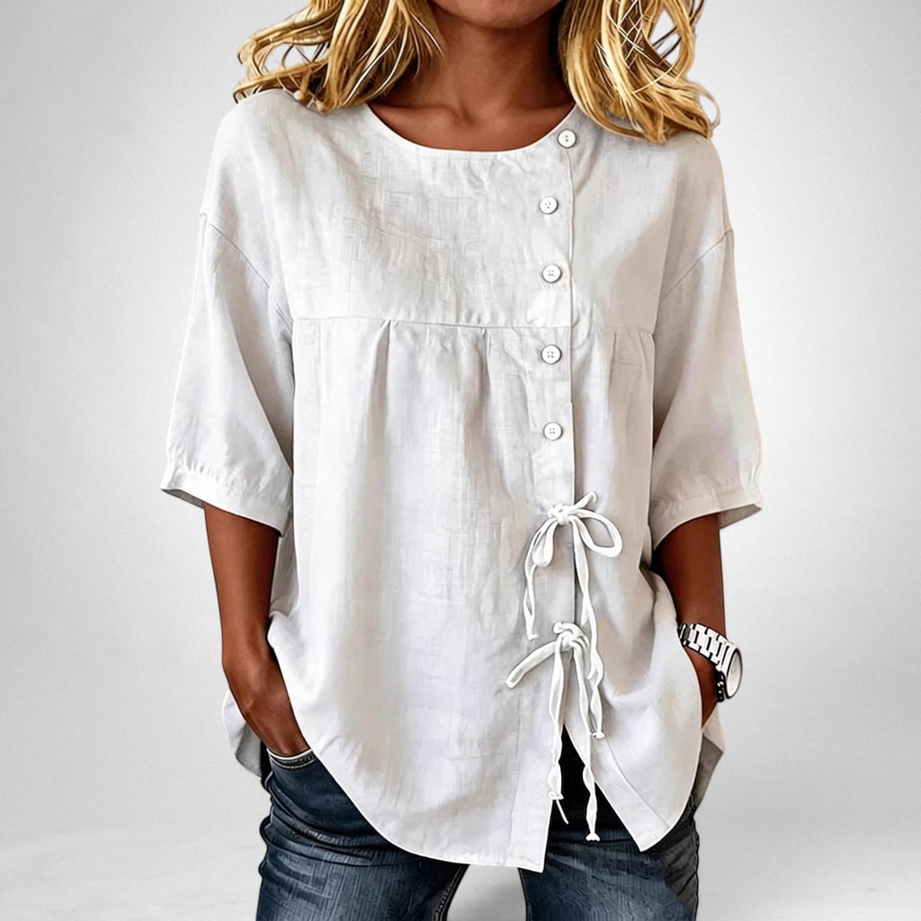ZOFIA ATELIER KLAUDIA asymmetric white linen shirt with lace-up detail and princess sleeves.
