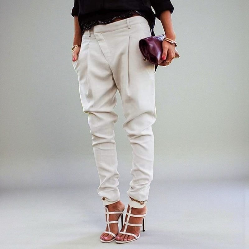 ZOFIA ATELIER KRYSTYNA high waist harem pants in cream, made from polyester blend. Features a relaxed fit with tapered legs and a unique crossover waist.