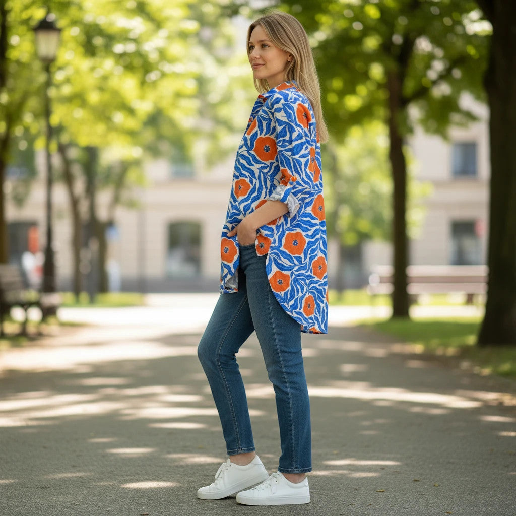 ZOFIA ATELIER LENA button-up blouse with orange floral print on blue fabric, relaxed fit, long sleeves.