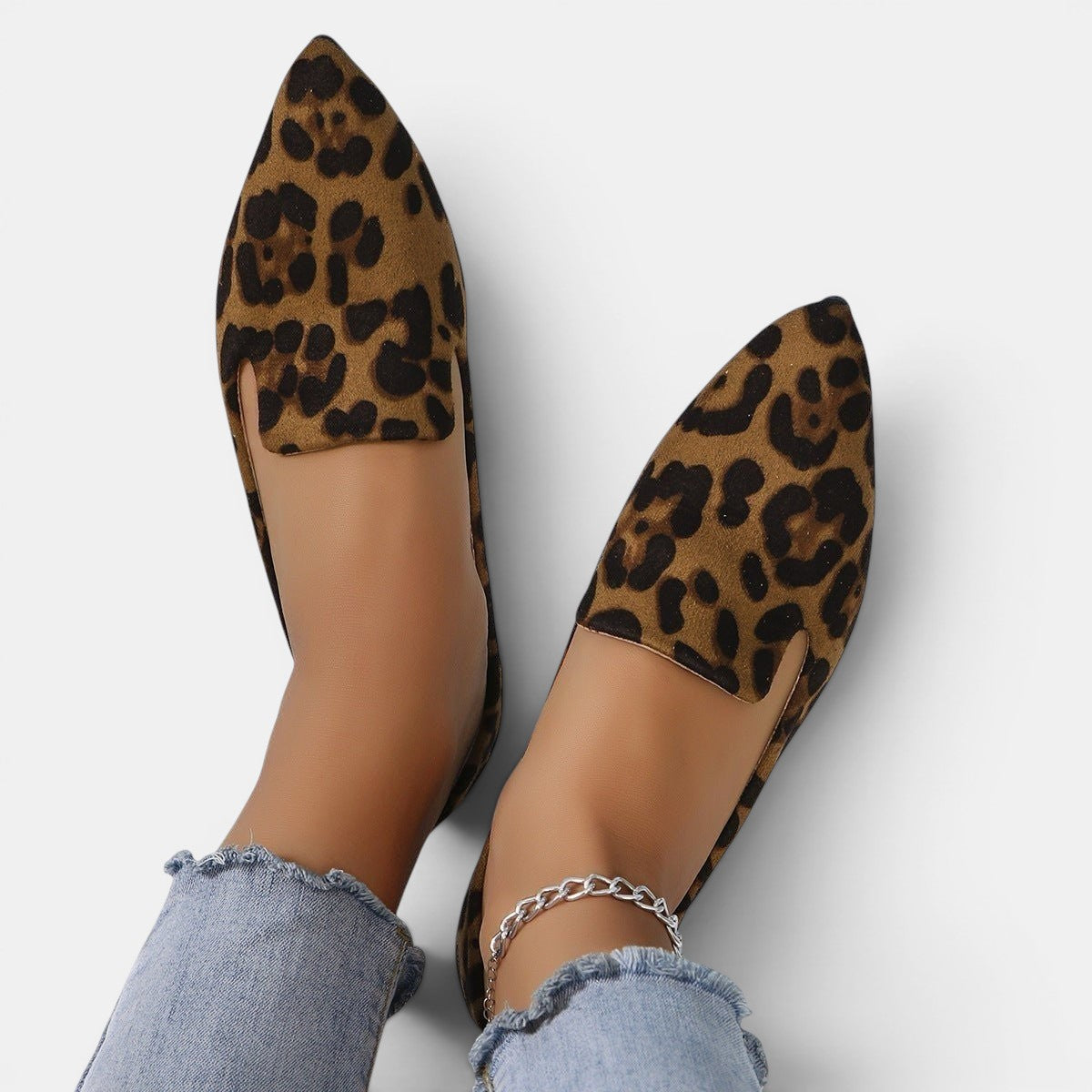 ZOFIA ATELIER leopard print pointed toe flats with a shallow-cut upper and slip-on design.