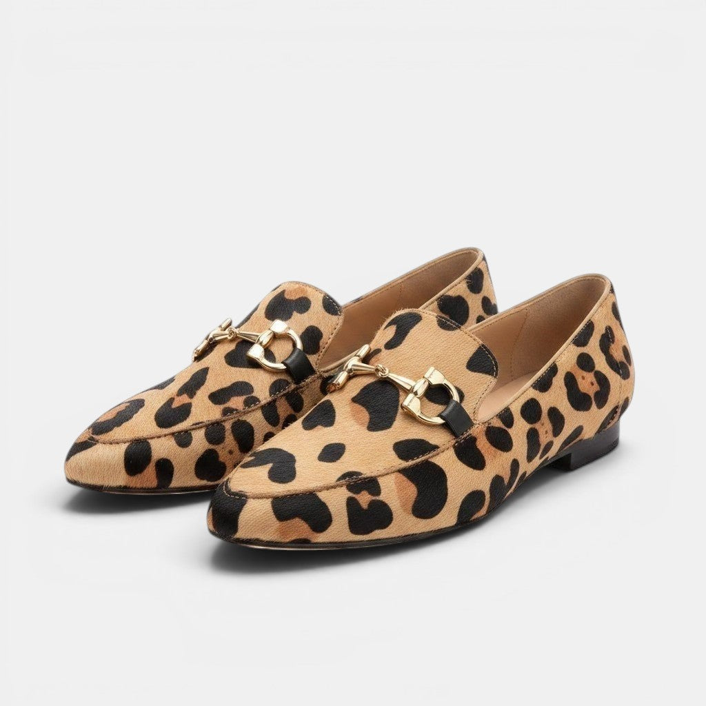 ZOFIA ATELIER leopard print pointed toe flat pumps with gold horsebit detail.