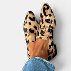 ZOFIA ATELIER leopard print pointed toe flat pumps with gold horsebit detail and shallow-cut upper.