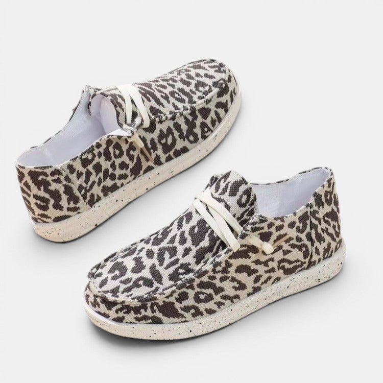 ZOFIA ATELIER leopard print flyknit flats with round toe and white laces. Comfortable everyday wear.