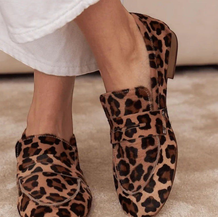 ZOFIA ATELIER leopard print calf hair loafers with a buckle detail and round toe.