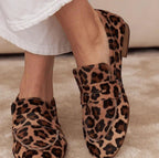 ZOFIA ATELIER leopard print calf hair loafers with a buckle detail and round toe.