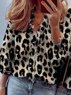 ZOFIA ATELIER Ewa leopard print ruffle blouse with split collar and long sleeves.