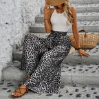 ZOFIA ATELIER women's high-waisted, wide-leg trousers in black and white leopard print polyester with pockets.