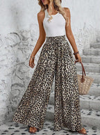 ZOFIA ATELIER leopard print wide-leg trousers made of polyester with a high waist and pockets.