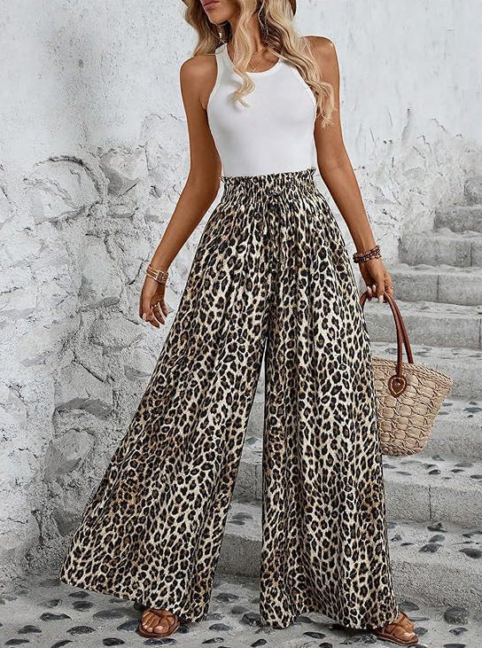 ZOFIA ATELIER leopard print wide-leg trousers made of polyester with a high waist and pockets.