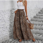 ZOFIA ATELIER leopard print wide-leg trousers in polyester with a high waist and pockets.