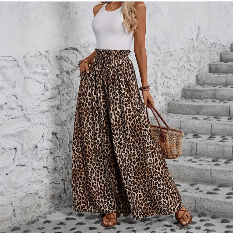 ZOFIA ATELIER leopard print wide-leg trousers in polyester with a high waist and pockets.