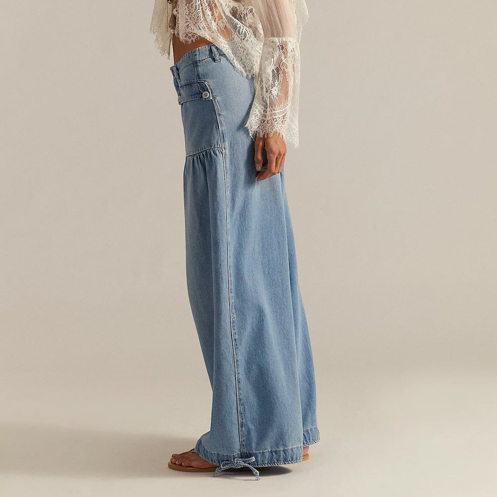 ZOFIA ATELIER light blue cotton loose mid-waist wide-leg jeans with distressed details and tie cuffs.