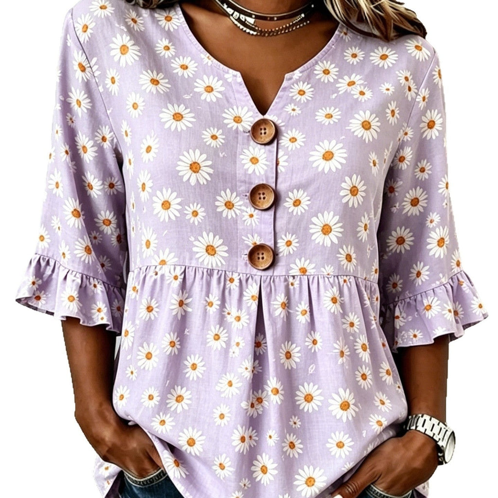 ZOFIA ATELIER lilac short-sleeved polyester top with a white daisy print, V-neck, and ruffled sleeves.