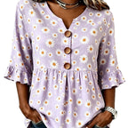 ZOFIA ATELIER lilac short-sleeved polyester top with a white daisy print, V-neck, and ruffled sleeves.