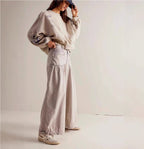 ZOFIA ATELIER light wash loose mid-waist cotton jeans with a wide leg and distressed details.