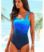 ZOFIA ATELIER LUDMIŁA vintage-inspired one-piece swimsuit with blue ombre wave pattern and scoop neck.