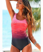ZOFIA ATELIER LUDMIŁA vintage-inspired one-piece swimsuit with ombre red and black gradient and criss-cross back detail.