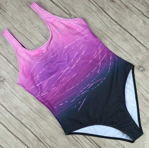 ZOFIA ATELIER LUDMIŁA vintage-inspired one-piece swimsuit with pink-to-black gradient and abstract linear print.