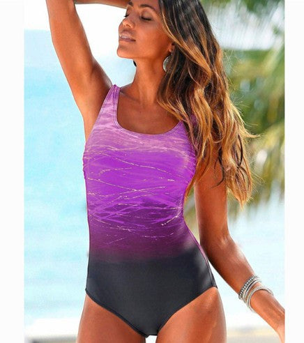 ZOFIA ATELIER LUDMIŁA vintage-inspired one-piece swimsuit with purple ombre and criss-cross back detail.