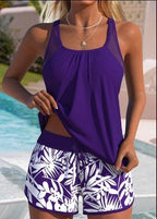ZOFIA ATELIER Magda bikini set: purple tankini top with mesh shoulders and white leaf-print shorts.