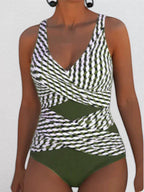 ZOFIA ATELIER Magdalena sleeveless one-piece swimsuit with green, white, and black striped pattern and solid green bottom.