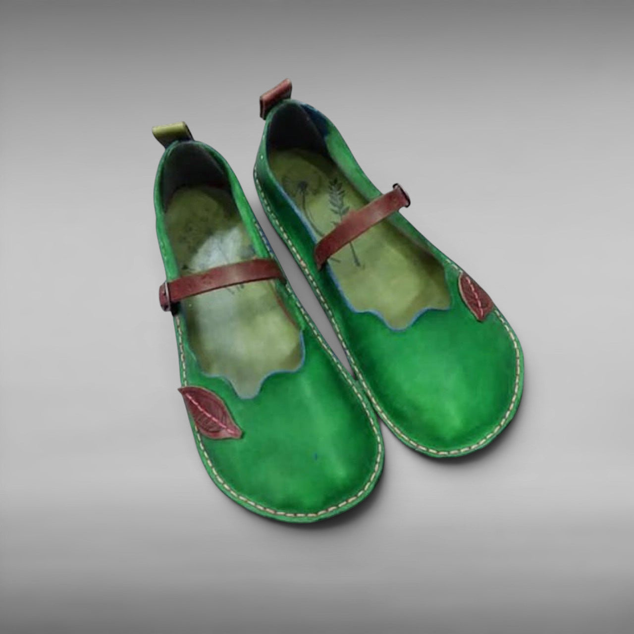 ZOFIA ATELIER MARIA ethnic green artificial PU sandals with round toe and leaf detail.