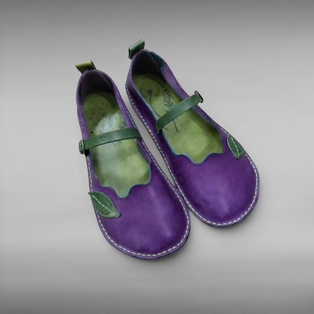 ZOFIA ATELIER MARIA ethnic single sandals in purple artificial PU with green leaf detail and strap.