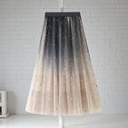 ZOFIA ATELIER Mariola sequin star skirt in net yarn, featuring a gradient from black to beige with scattered star embellishments.