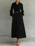 ZOFIA ATELIER Marisol black maxi shirt dress with sheer puff sleeves, collared neckline, button front, and belt.
