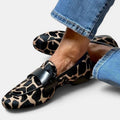 ZOFIA ATELIER Marta loafers in giraffe print with black strap detail and round toe.