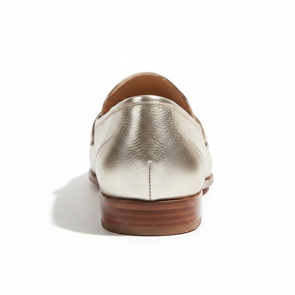 ZOFIA ATELIER MILA classic gold leather loafers with a low heel and stitched detailing.