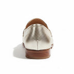 ZOFIA ATELIER MILA classic gold leather loafers with a low heel and stitched detailing.