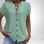 ZOFIA ATELIER Elżbieta jacquard V-neck blouse in mint green with a textured dot pattern and brown buttons.