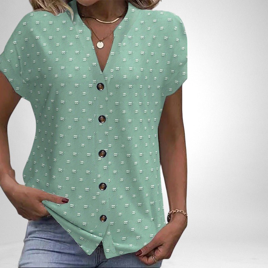 ZOFIA ATELIER Elżbieta jacquard V-neck blouse in mint green with a textured dot pattern and brown buttons.