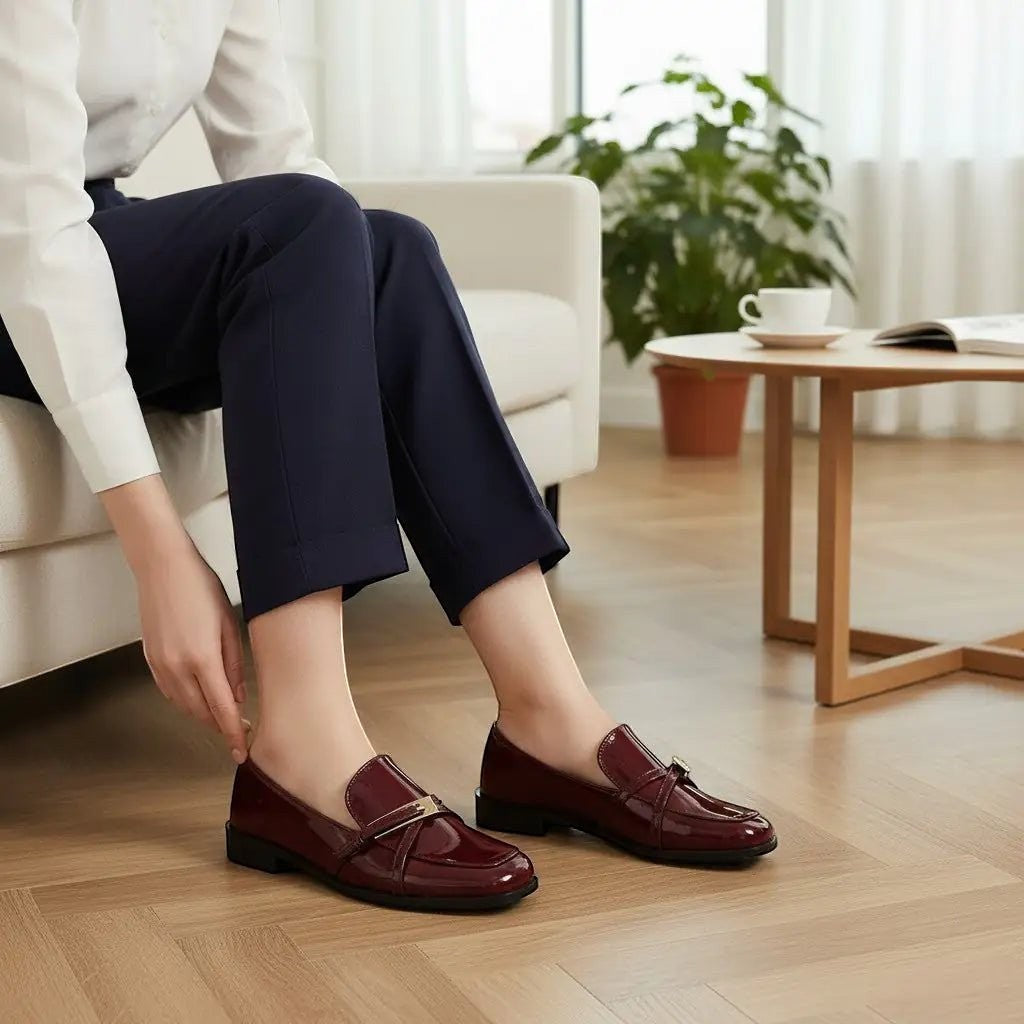 ZOFIA ATELIER Natalia patent square toe loafers in deep burgundy. Flat, slip-on style with gold buckle detail.