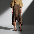 ZOFIA ATELIER Natalia pleated midi skirt in khaki, 100% polyester, high-waist design with an asymmetrical hem.