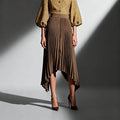 ZOFIA ATELIER Natalia pleated midi skirt in khaki, 100% polyester, high-waist design with an asymmetrical hem.