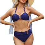 ZOFIA ATELIER navy blue high-waisted bikini with gold ring details. Halter top and adjustable straps.