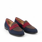 ZOFIA ATELIER navy blue and brown suede slip-on loafers with red trim and a round toe.