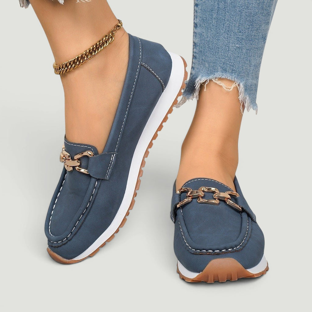 ZOFIA ATELIER navy blue faux leather chain platform loafers with white stitching and gold hardware.