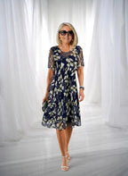 ZOFIA ATELIER navy blue chiffon dress with white floral print, A-line skirt, high waist, and short sleeves.