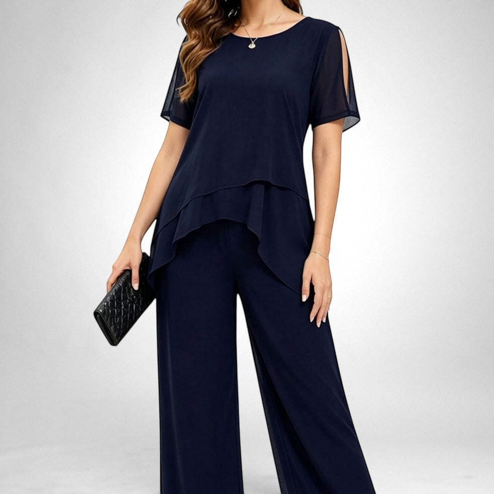 ZOFIA ATELIER navy blue chiffon patchwork set with wide-leg pants and layered top with cold shoulder detail.