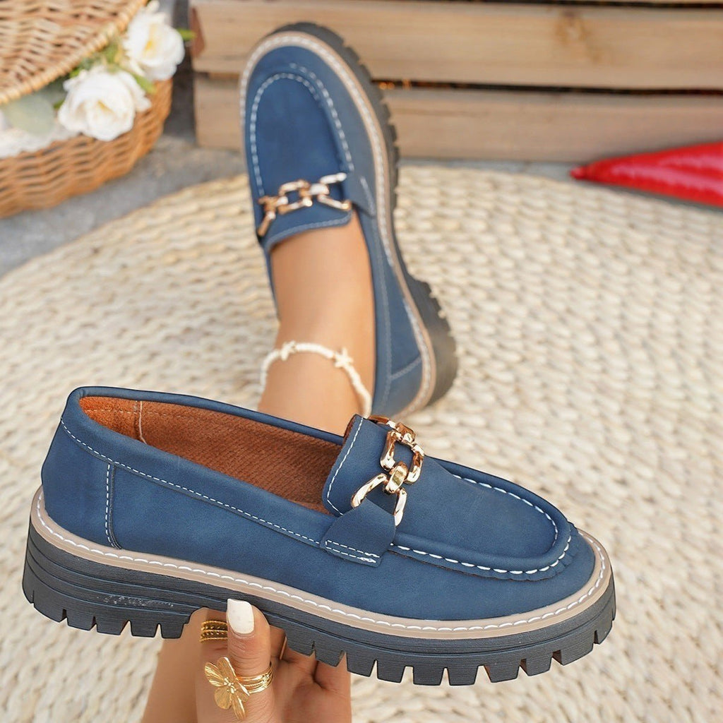 ZOFIA ATELIER navy blue chunky platform loafers with gold chain detail and white stitching.