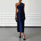 ZOFIA ATELIER navy blue satin one-shoulder midi dress with waist-cinching detail and flowing skirt.