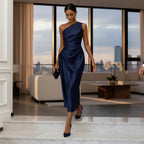 ZOFIA ATELIER navy blue satin one-shoulder midi dress with waist-cinching detail and artful pleats.