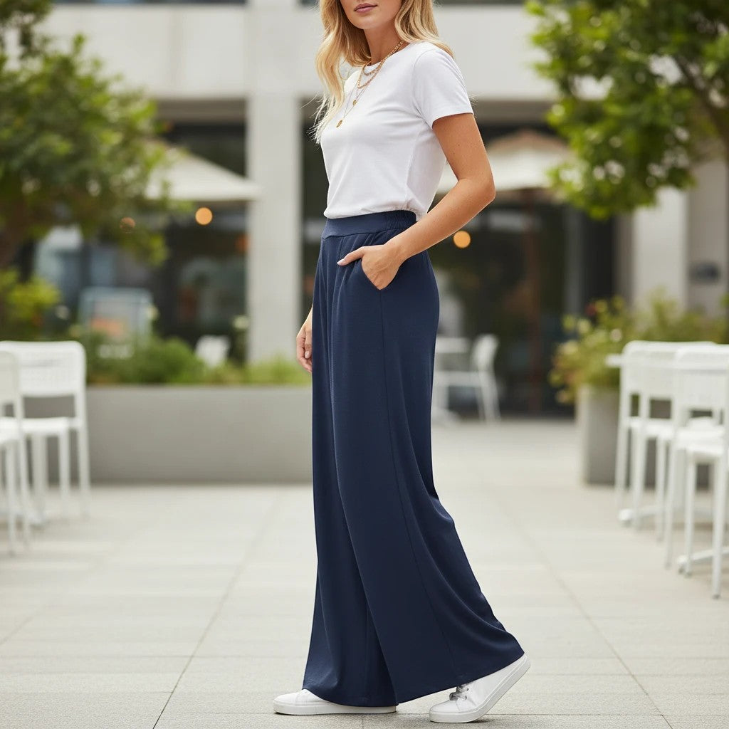ZOFIA ATELIER navy polyester wide-leg trousers with pockets, high-waisted, full-length, paired with a white t-shirt and sneakers.
