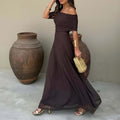 ZOFIA ATELIER dark brown off-shoulder sheer maxi dress with ruched detail and high waist, made of stretch polyester.