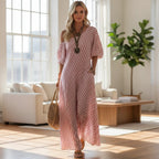 ZOFIA ATELIER off-shoulder maxi dress in pink and white stripes, made of polyester, with short sleeves and pockets.