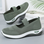 ZOFIA ATELIER olive green knit slip-on walking shoes with white soles and a low heel.
